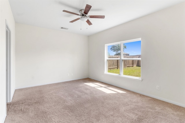 carpeted empty room with ceiling fan