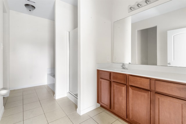 bathroom with tile patterned flooring, vanity, and plus walk in shower