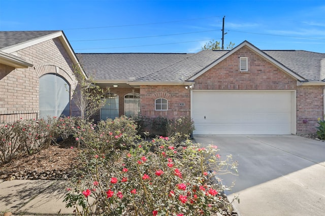 single story home featuring a garage