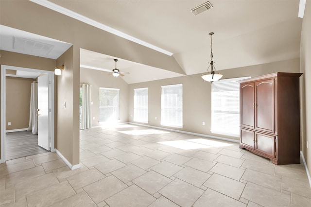 interior space featuring ceiling fan and vaulted ceiling