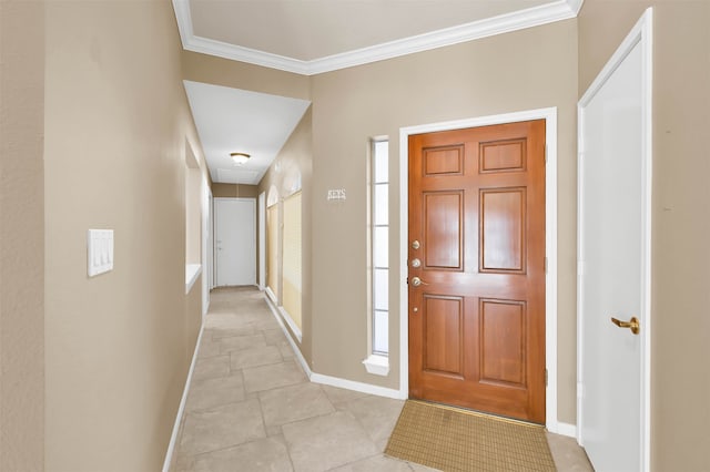 foyer entrance featuring ornamental molding and light tile patterned floors