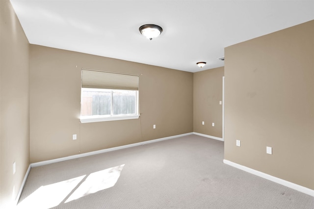 unfurnished room with light colored carpet