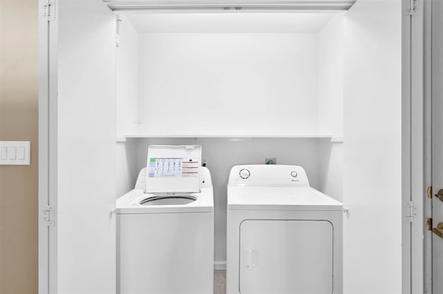 laundry area with independent washer and dryer