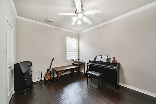 misc room featuring dark hardwood / wood-style flooring, ceiling fan, and crown molding