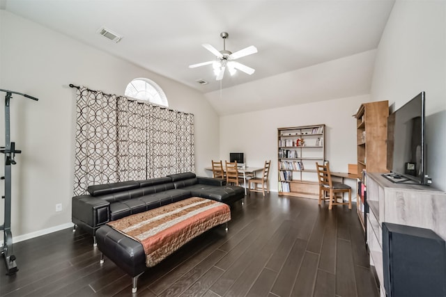 living room with lofted ceiling, ceiling fan, and dark hardwood / wood-style floors