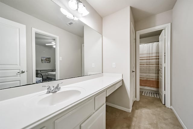 bathroom featuring tile patterned flooring and vanity