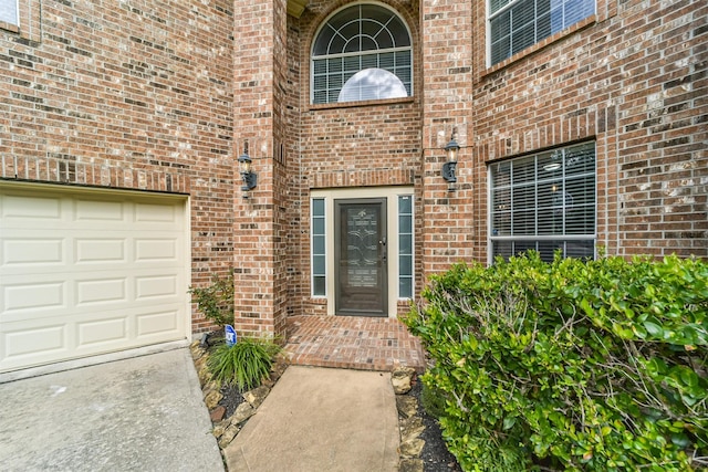 view of exterior entry featuring a garage