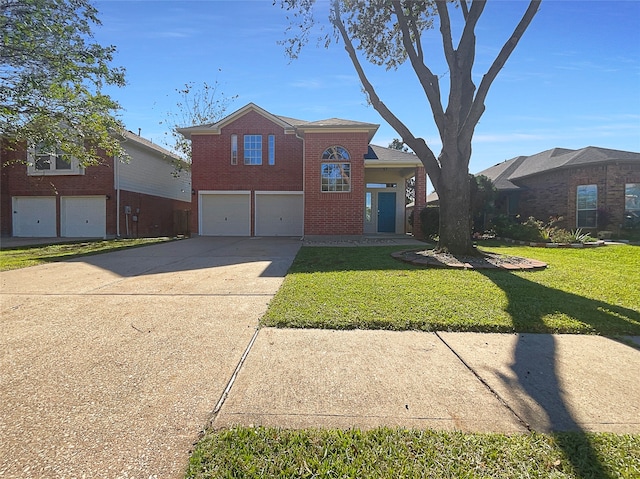 view of front of house with a front yard and a garage