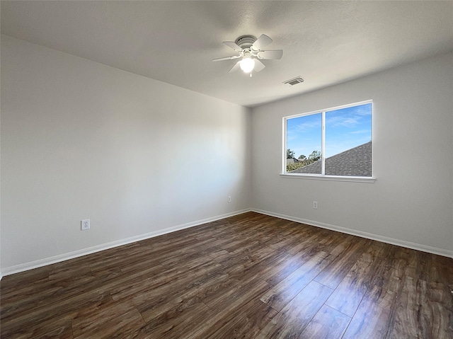 18131 Dusty Terrace Ln, Katy, TX 77449 - empty room featuring dark wood-style flooring, visible vents, baseboards, and a ceiling fan