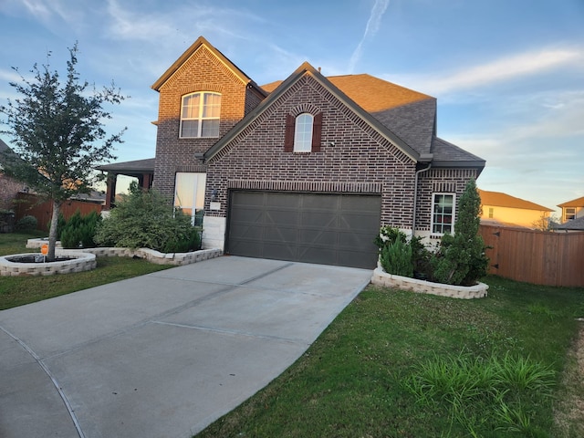 view of front property with a lawn and a garage