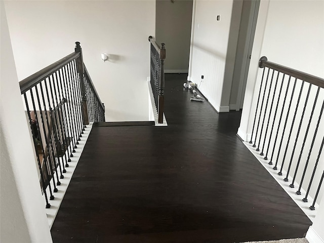 staircase featuring hardwood / wood-style flooring