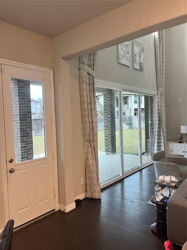 entryway with dark wood-type flooring