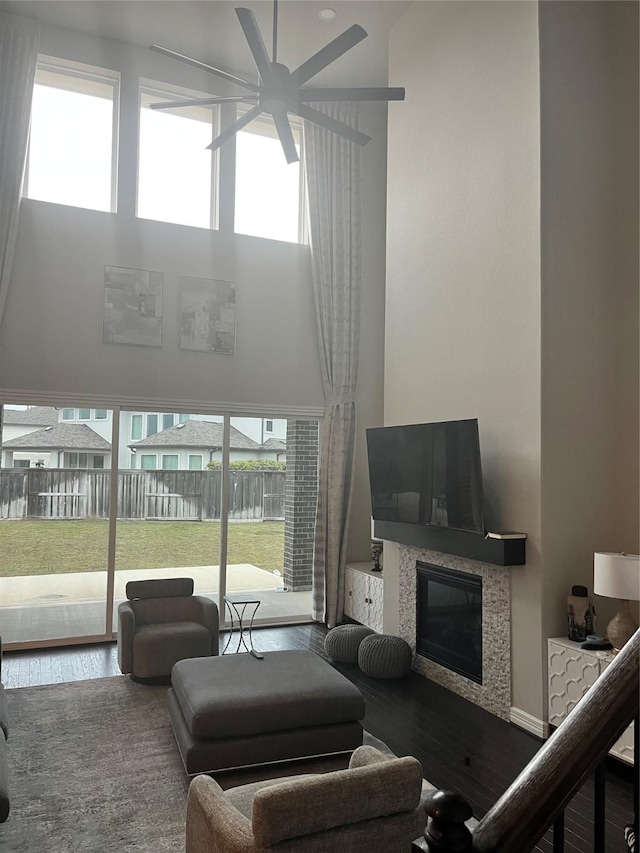 living room featuring hardwood / wood-style flooring and ceiling fan