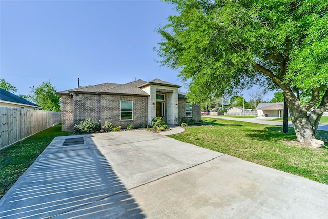 rear view of house featuring a lawn