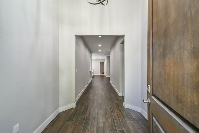 corridor with dark wood-type flooring