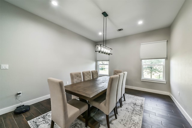 dining area featuring dark hardwood / wood-style flooring