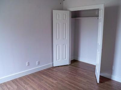 unfurnished bedroom featuring hardwood / wood-style floors and a closet