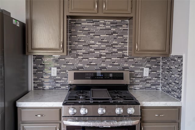 kitchen featuring stainless steel appliances and decorative backsplash