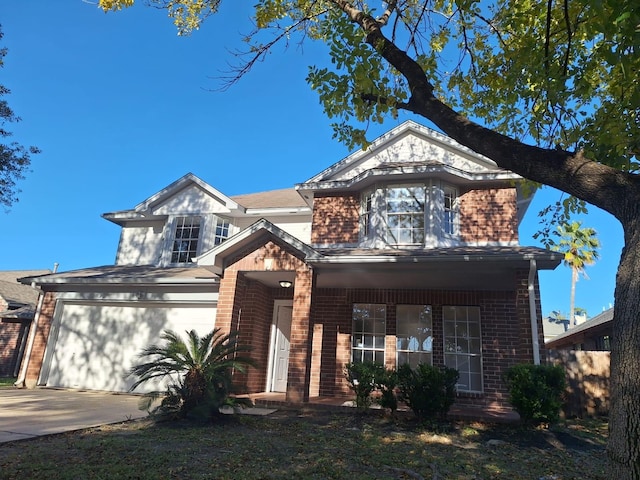 view of front of house featuring a garage and covered porch