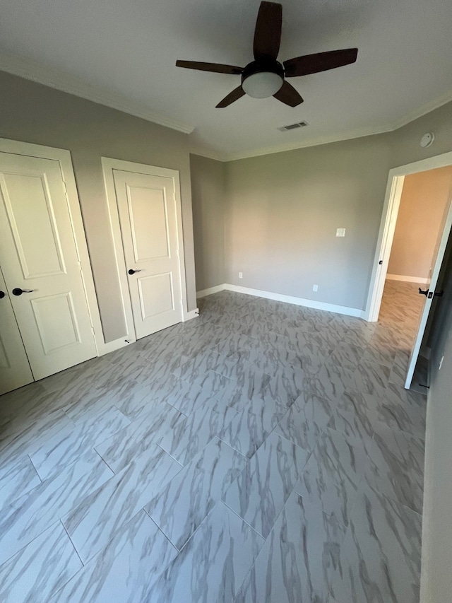 unfurnished bedroom with ceiling fan and ornamental molding