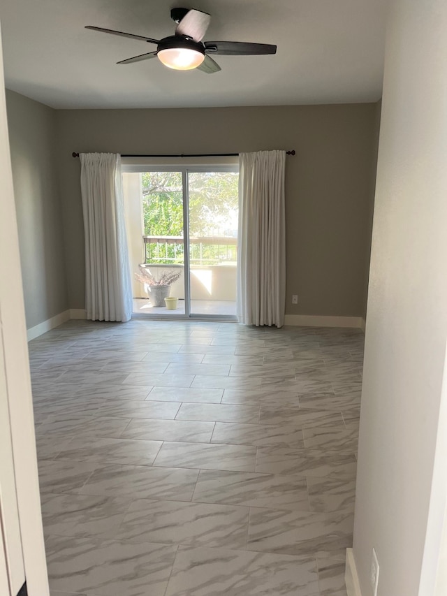 spare room with ceiling fan