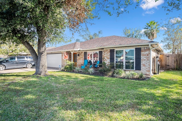 single story home with a front yard and a garage