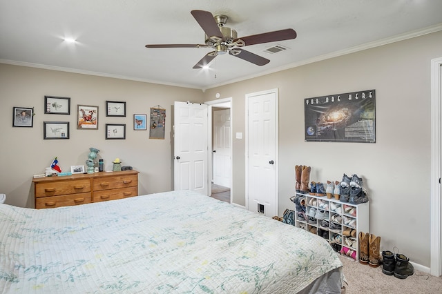 carpeted bedroom with ceiling fan and crown molding