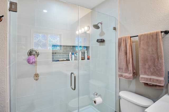 4515 Ponca St, Pasadena, TX 77504 - full bathroom with a stall shower, toilet, and a textured wall