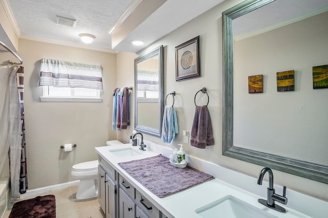 4515 Ponca St, Pasadena, TX 77504 - bathroom with double vanity, a textured ceiling, toilet, tile patterned floors, and crown molding
