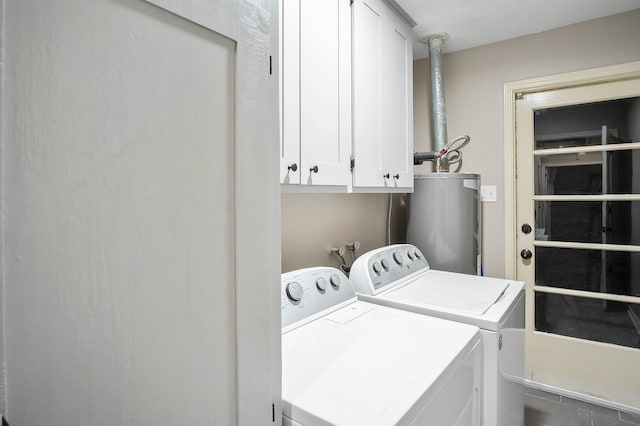 laundry area with cabinets, gas water heater, and independent washer and dryer