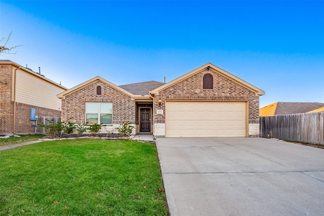 single story home featuring a garage and a front lawn