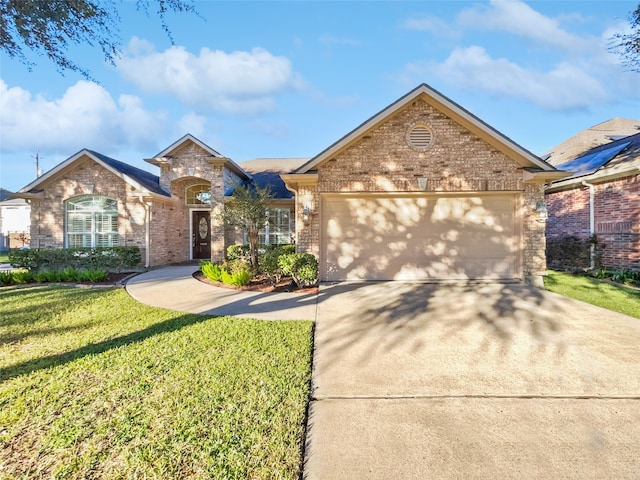 view of front facade with a garage and a front lawn