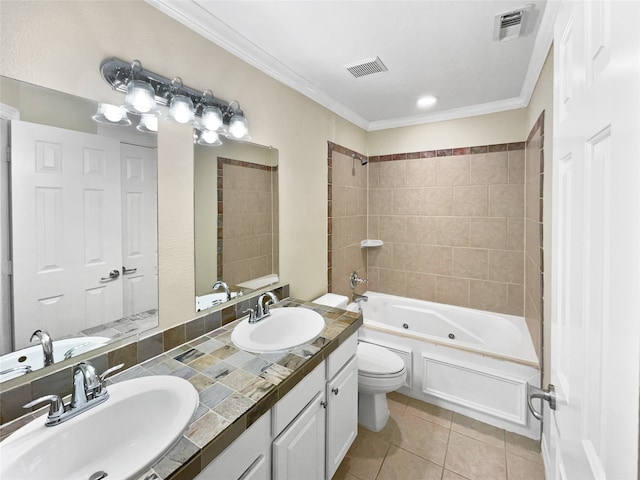 full bathroom with tile patterned floors, vanity, crown molding, toilet, and tiled shower / bath