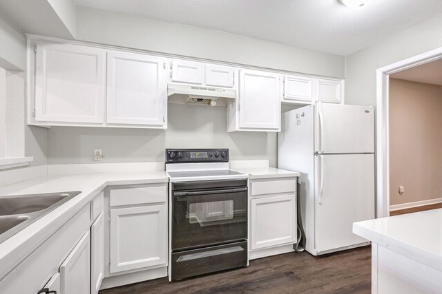 kitchen with white cabinets, white fridge, and black electric range