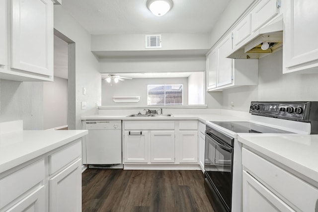 kitchen featuring white dishwasher, black electric range oven, white cabinetry, and dark wood-type flooring