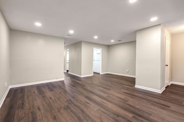 spare room featuring dark hardwood / wood-style floors