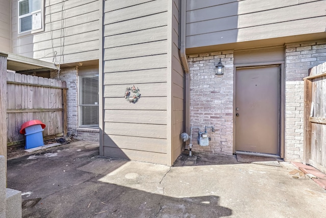 property entrance with a patio