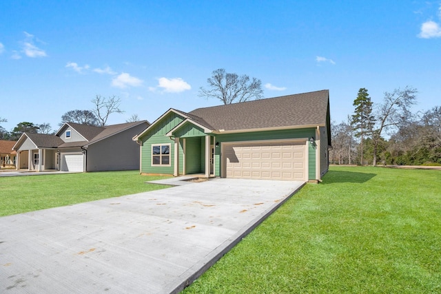 view of front of property featuring a front lawn and a garage