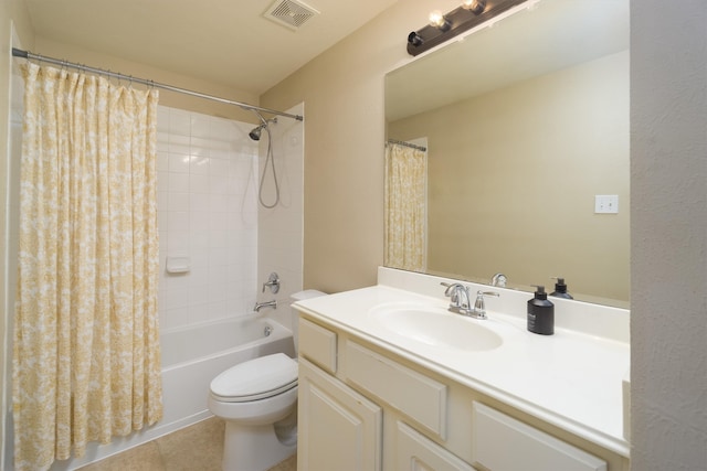 full bathroom with tile patterned flooring, shower / bath combination with curtain, vanity, and toilet