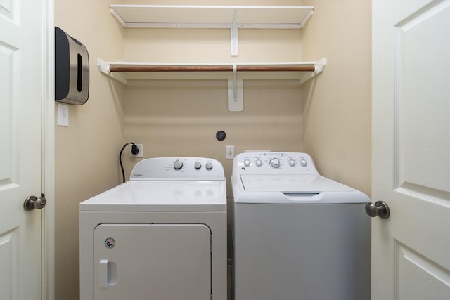 laundry room with washing machine and dryer