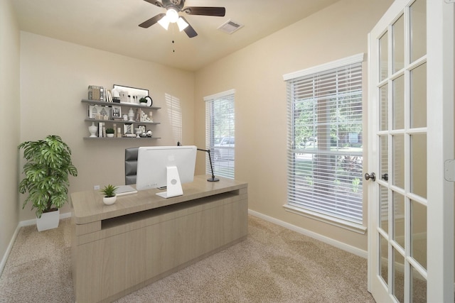 office with ceiling fan, light colored carpet, and french doors