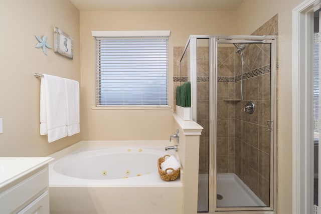 bathroom featuring vanity and shower with separate bathtub