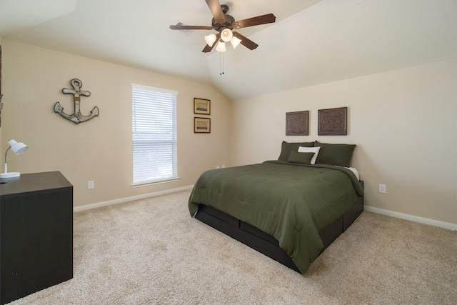 bedroom with ceiling fan, light colored carpet, and lofted ceiling