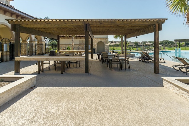 exterior space with a pergola, a patio, and a swimming pool