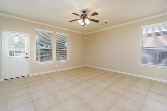 unfurnished room featuring ceiling fan and crown molding