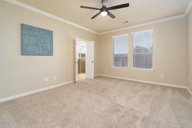 carpeted empty room featuring ceiling fan and ornamental molding