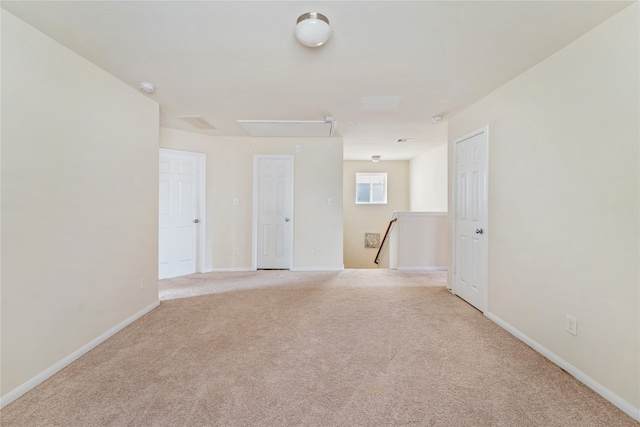 empty room featuring light carpet