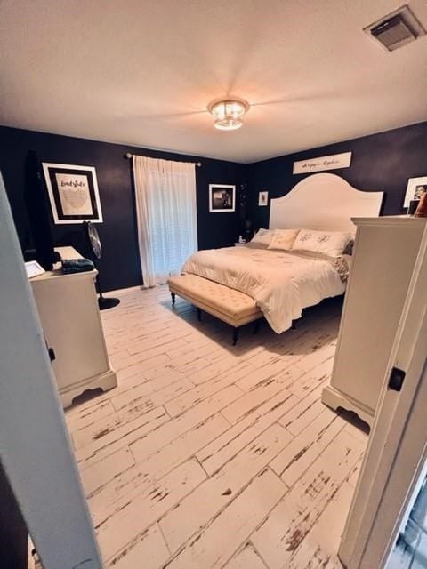 bedroom with hardwood / wood-style floors