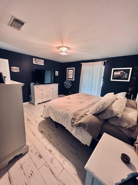 bedroom featuring light hardwood / wood-style floors