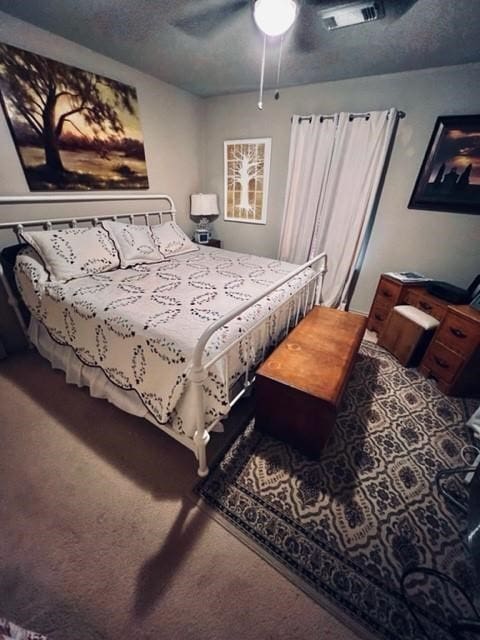 bedroom featuring carpet flooring and ceiling fan